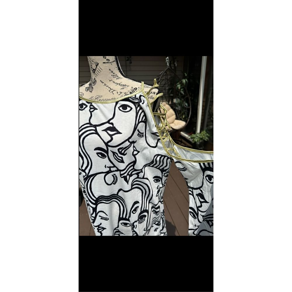 Miss Look abstract cut out sleeve gold, trim, tunic top. Says xxxl but it fits l